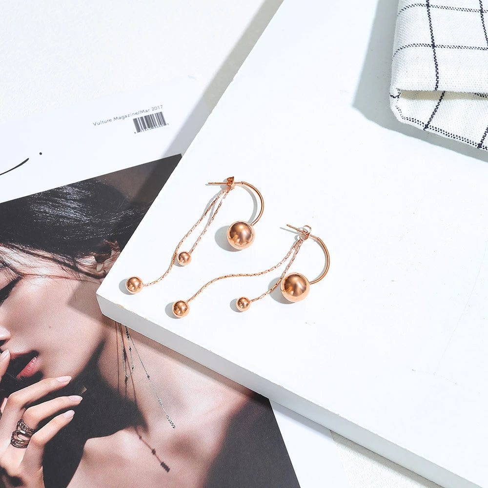 Boucle d&#39;Oreille pendante boule rose