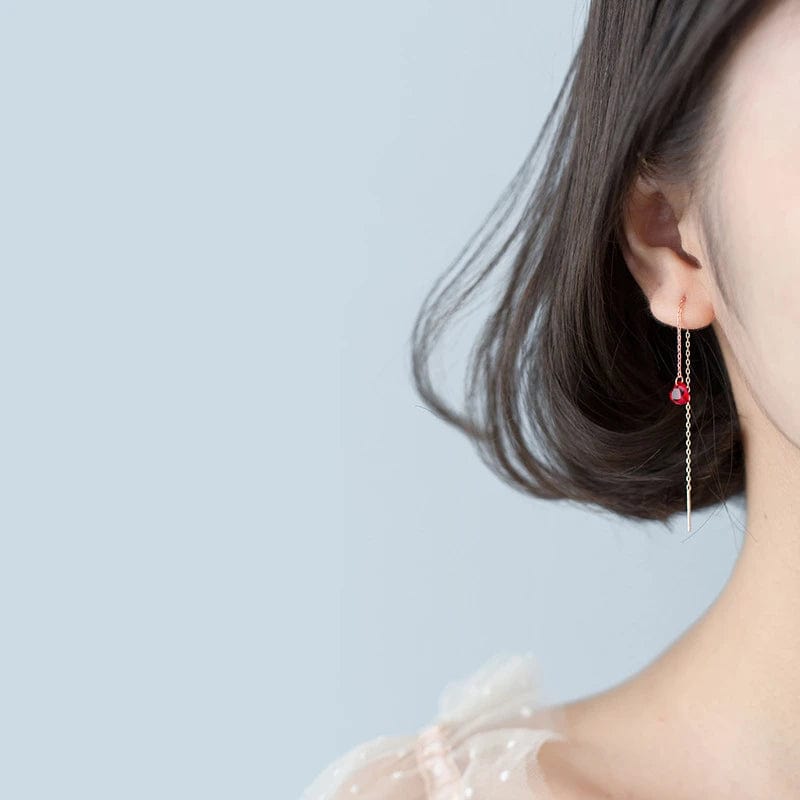 Boucle d'oreille chaine traversante or rose